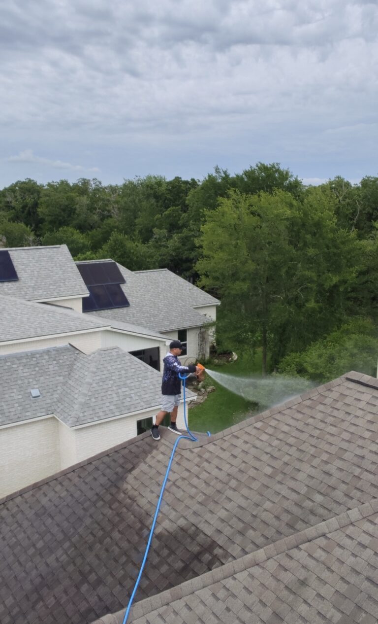 Roof soft washing seen from the roof in College Station Texas