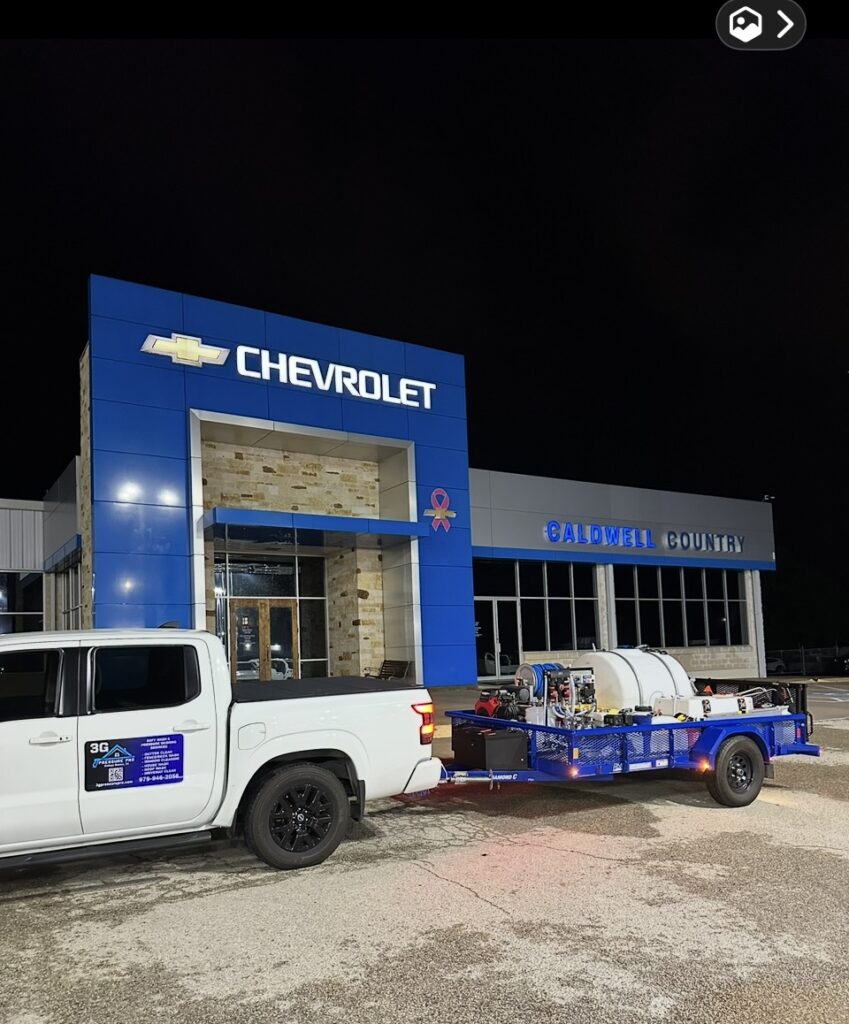 Commercial building soft wash on a Chevrolet dealership in Caldwell, TX by 3G Pressure Pro