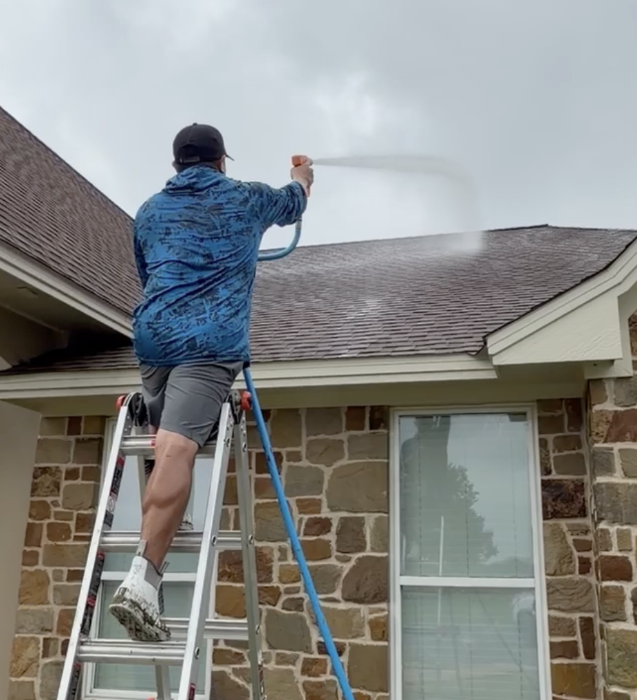 Roof wash on a stone home in Franklin TX