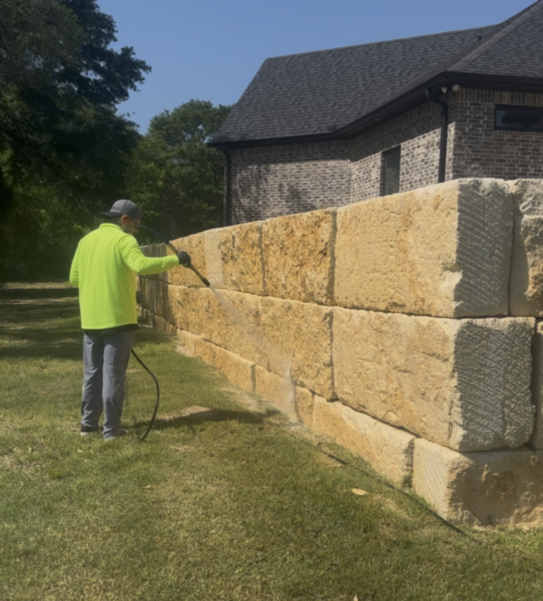 Limestone retainer wall soft wash in Iola TX