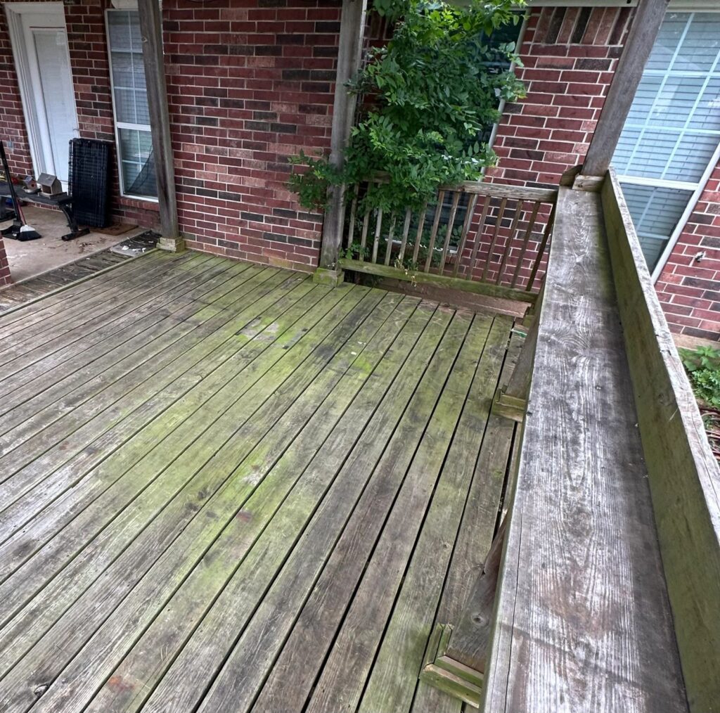 Heavy tree pollen and grime buildup on a wood deck in College Station