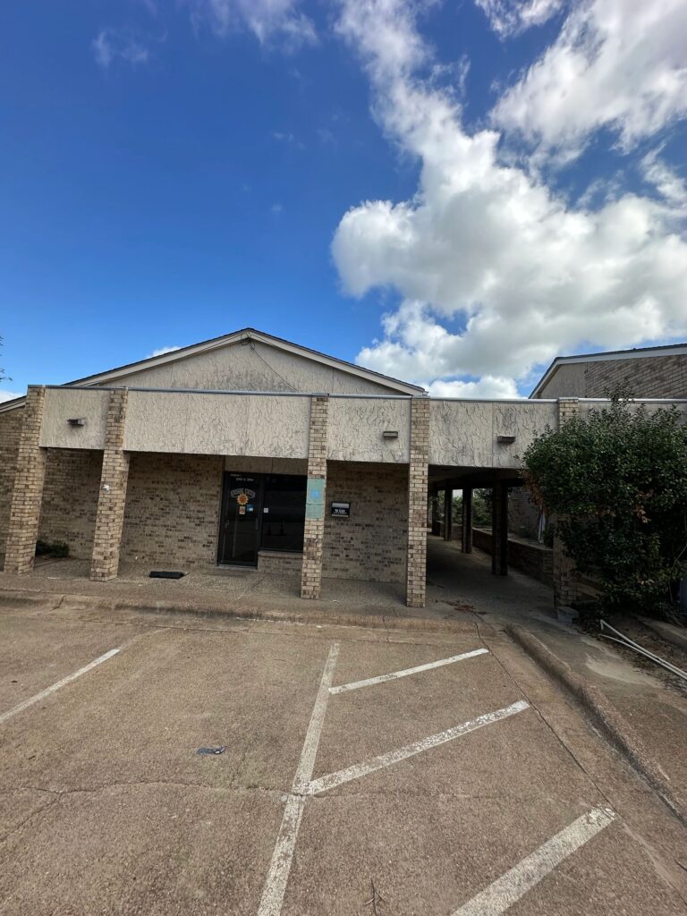 Commercial building before pressure washing in Bryan, TX