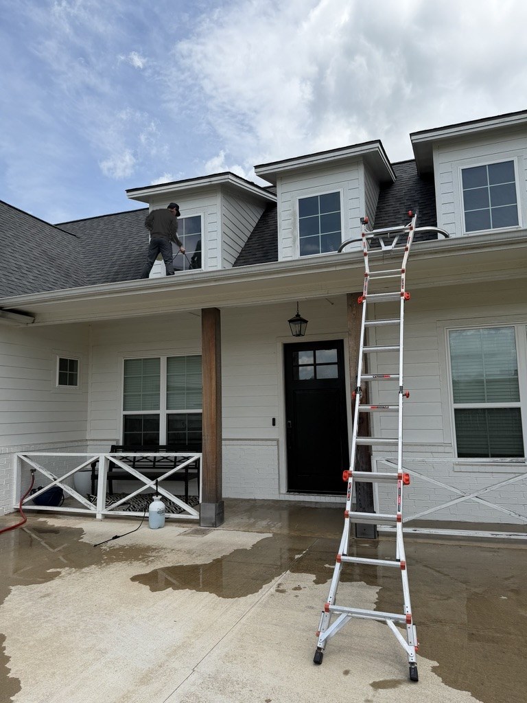 House washing a two-story home in Montgomery, TX