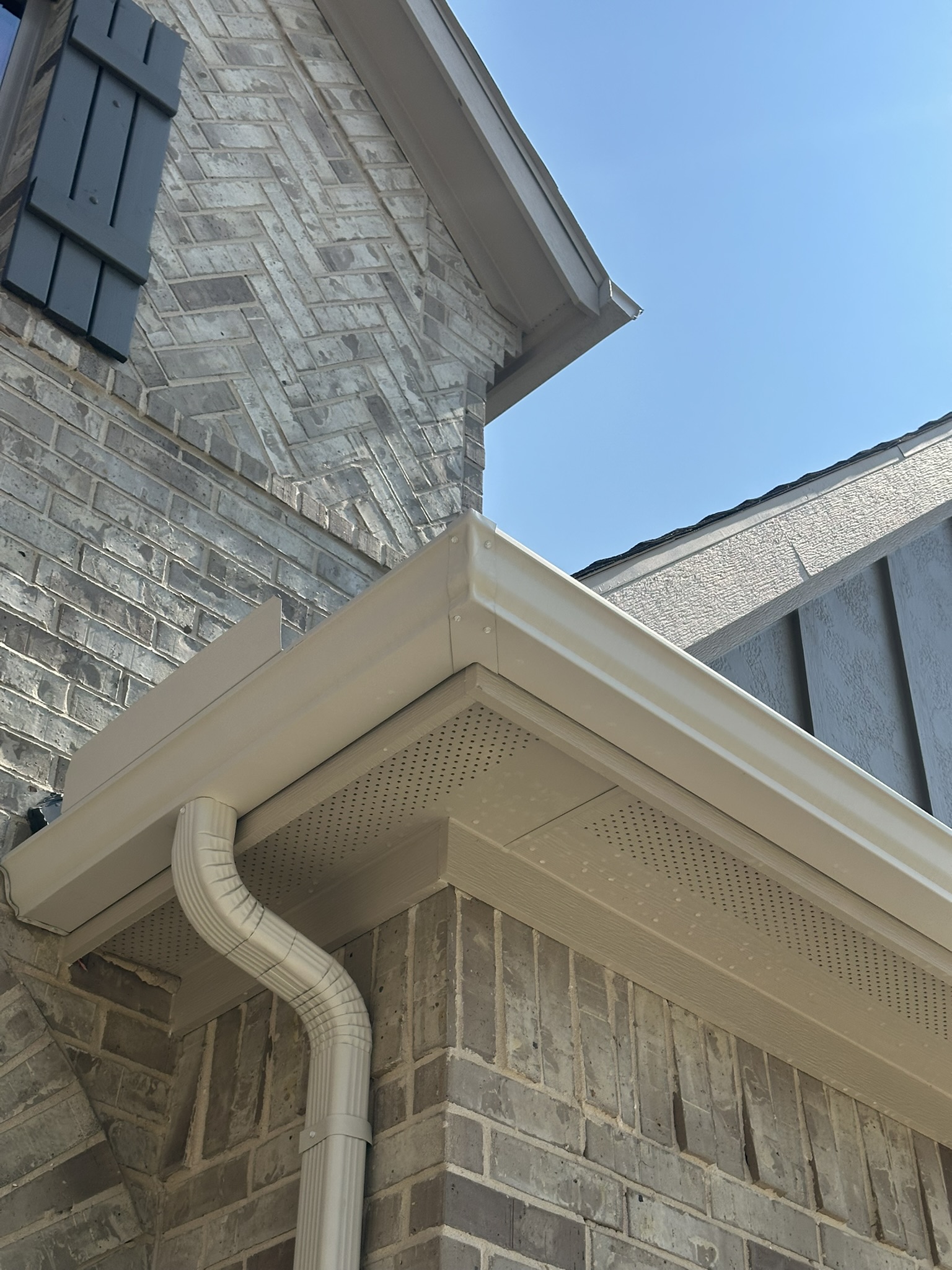 Bright clean gutters after gutter brightening in Bryan TX