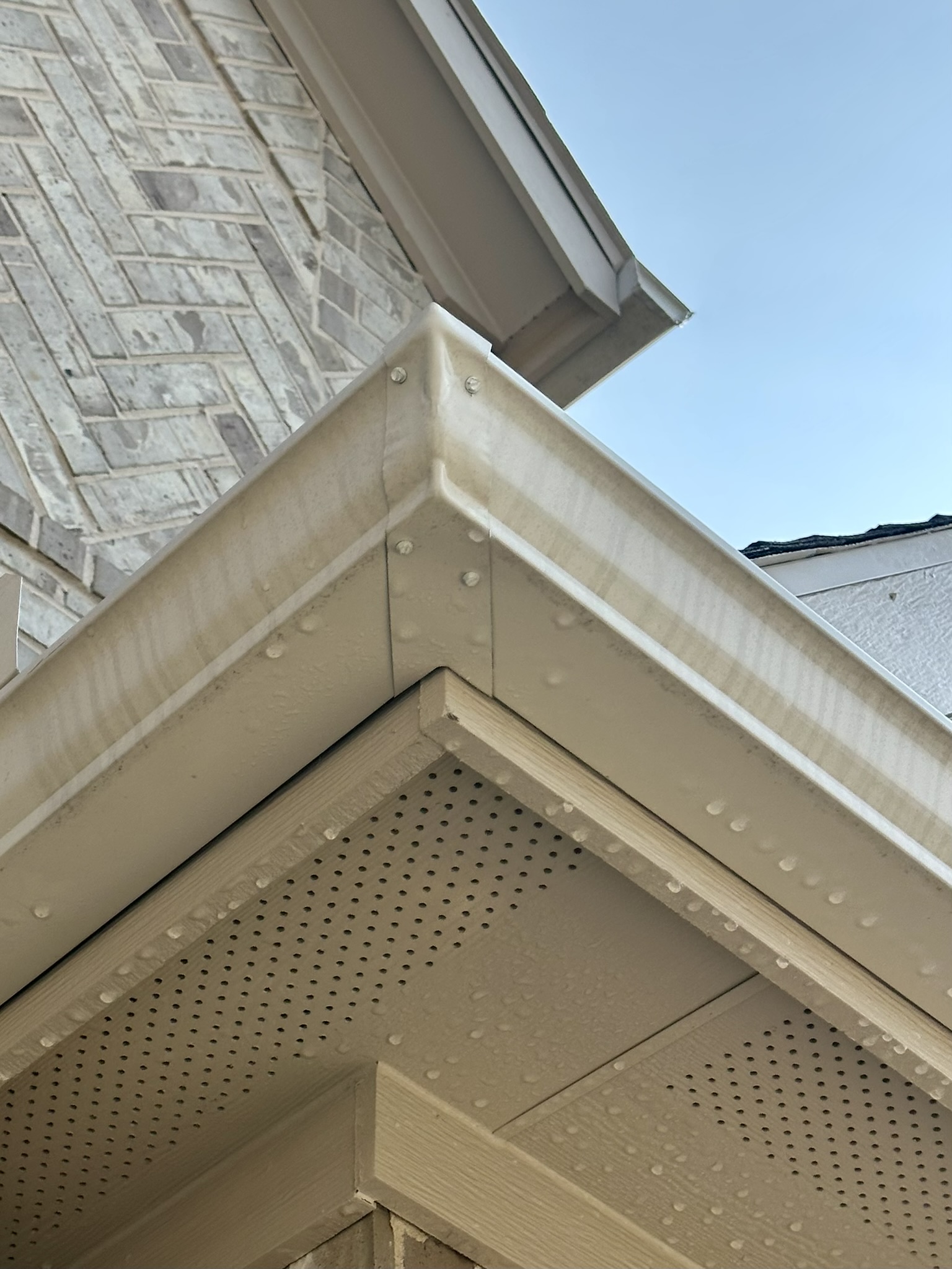 Gutter tiger stripes before gutter brightening in Bryan TX