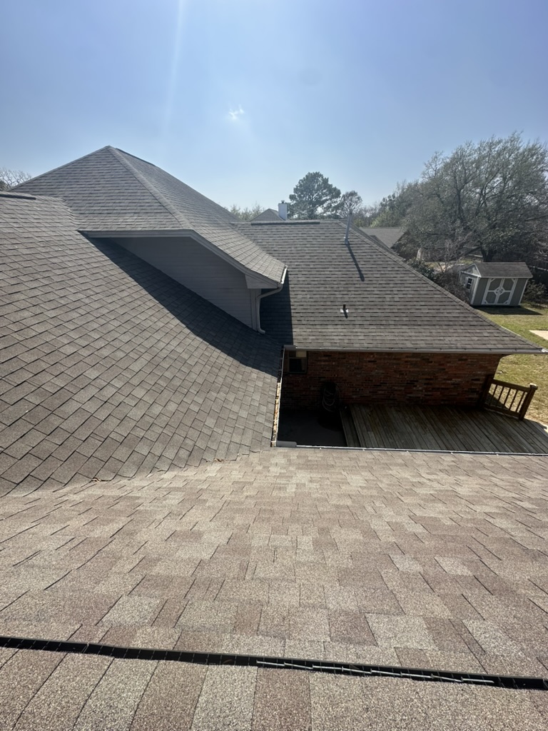 Clean roof after soft washing removed black streaks in south College Station Texas