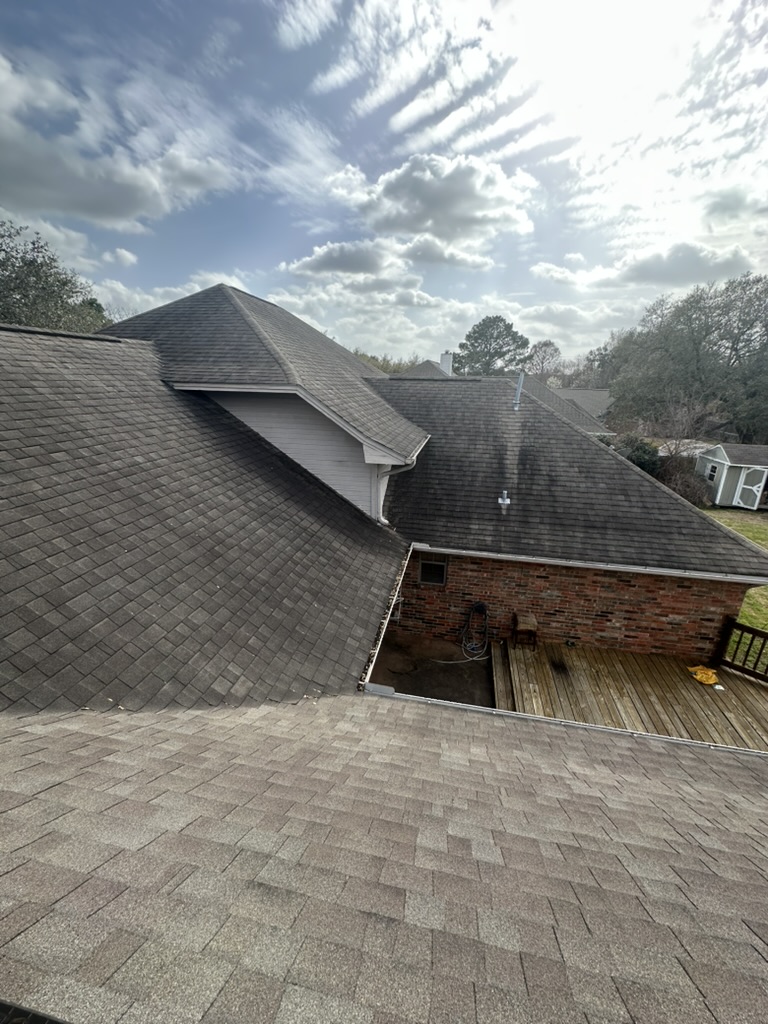 Roof with black algae streaks before soft washing in south College Station Texas